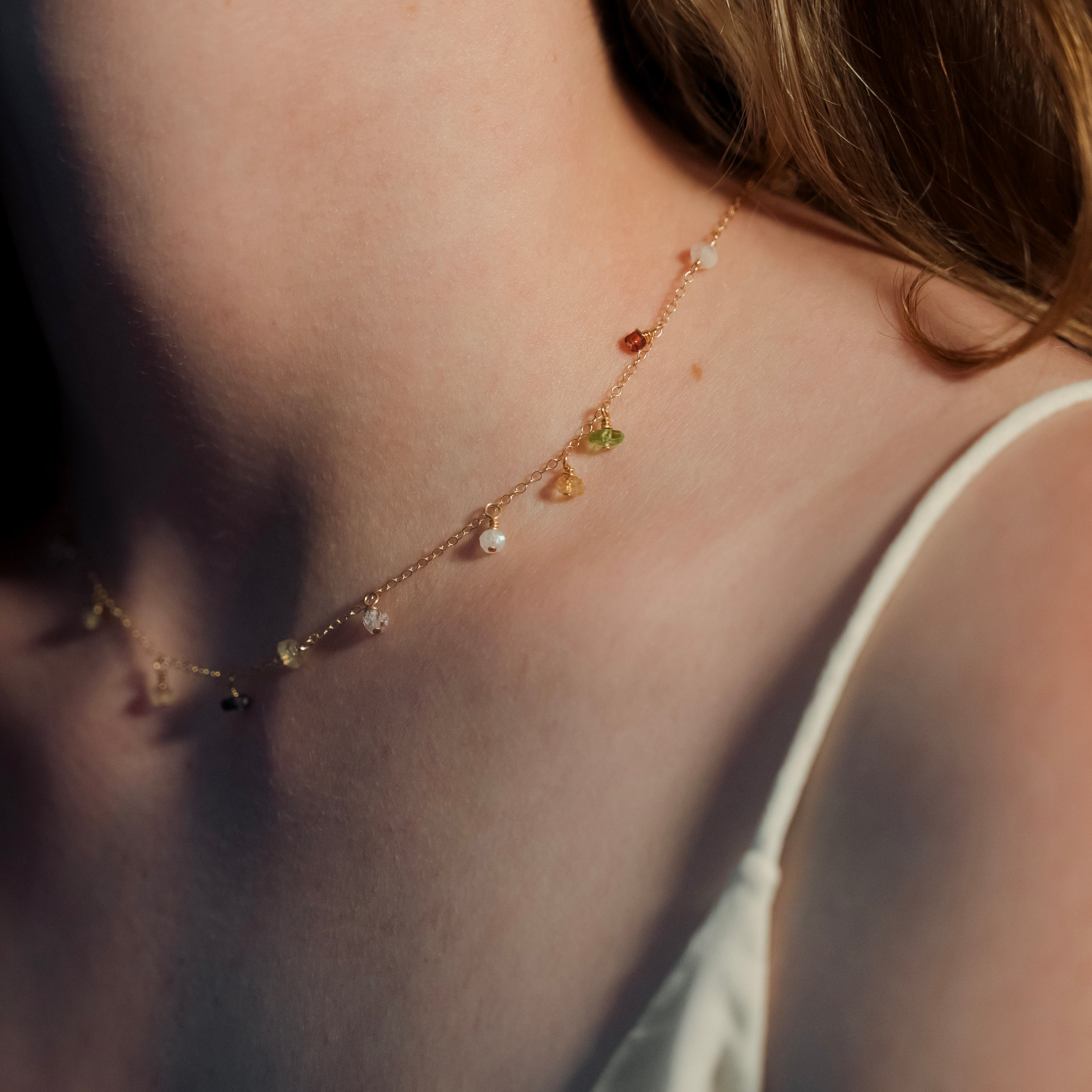 Necklace with colorful beads on a person's neck