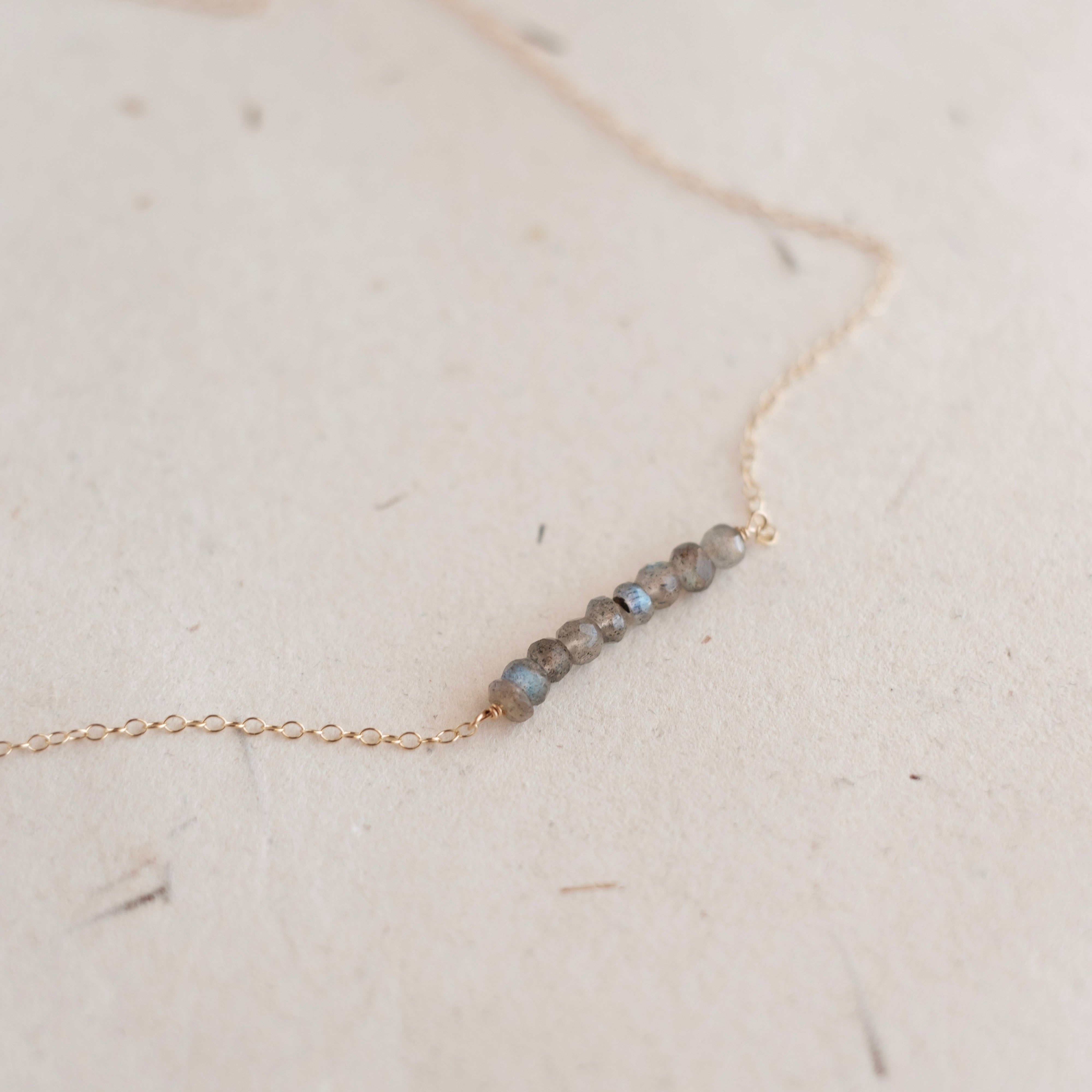Necklace with small beads on a light background